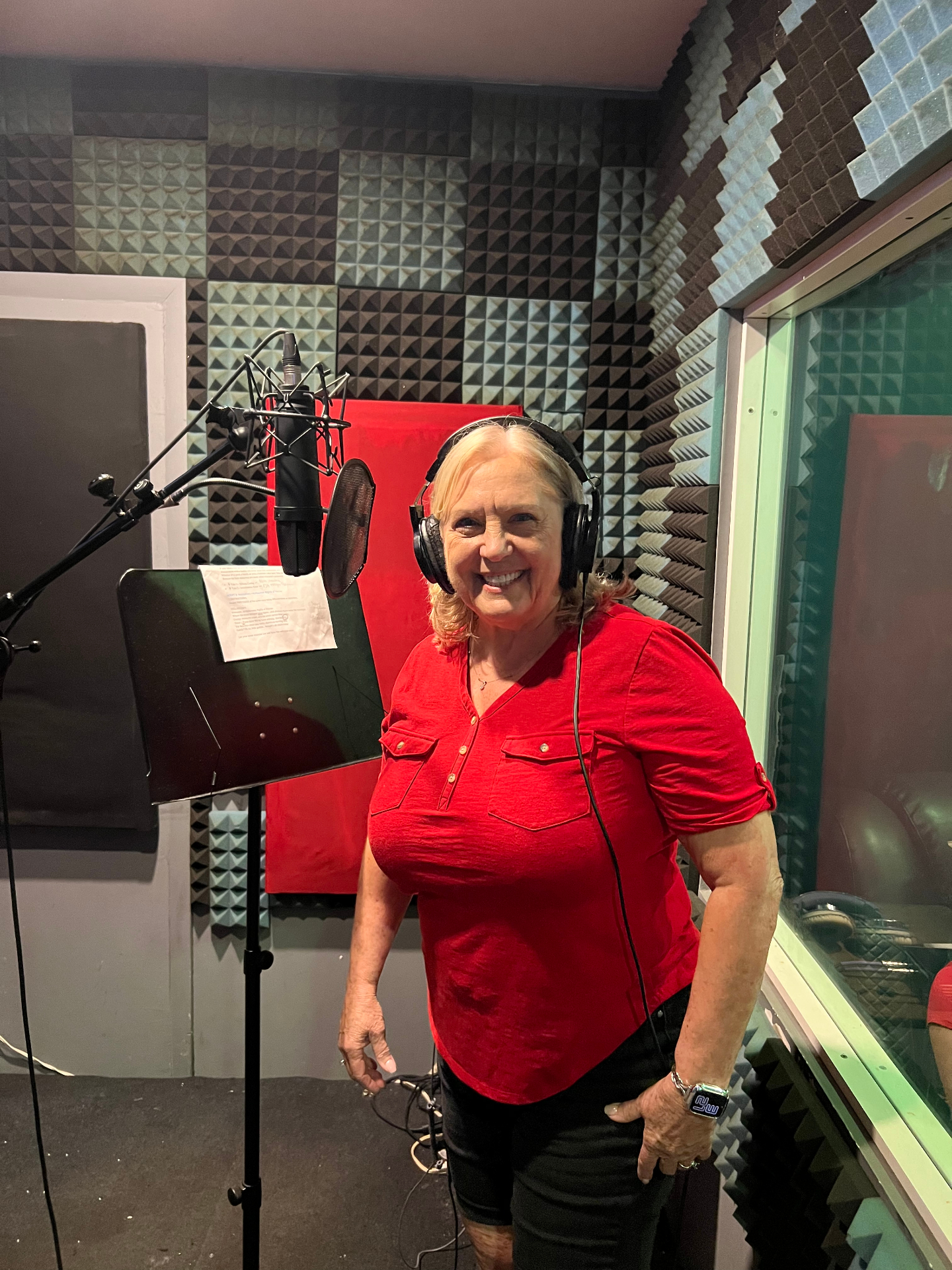 Cookie Colletti voice over artist recording in professional studio